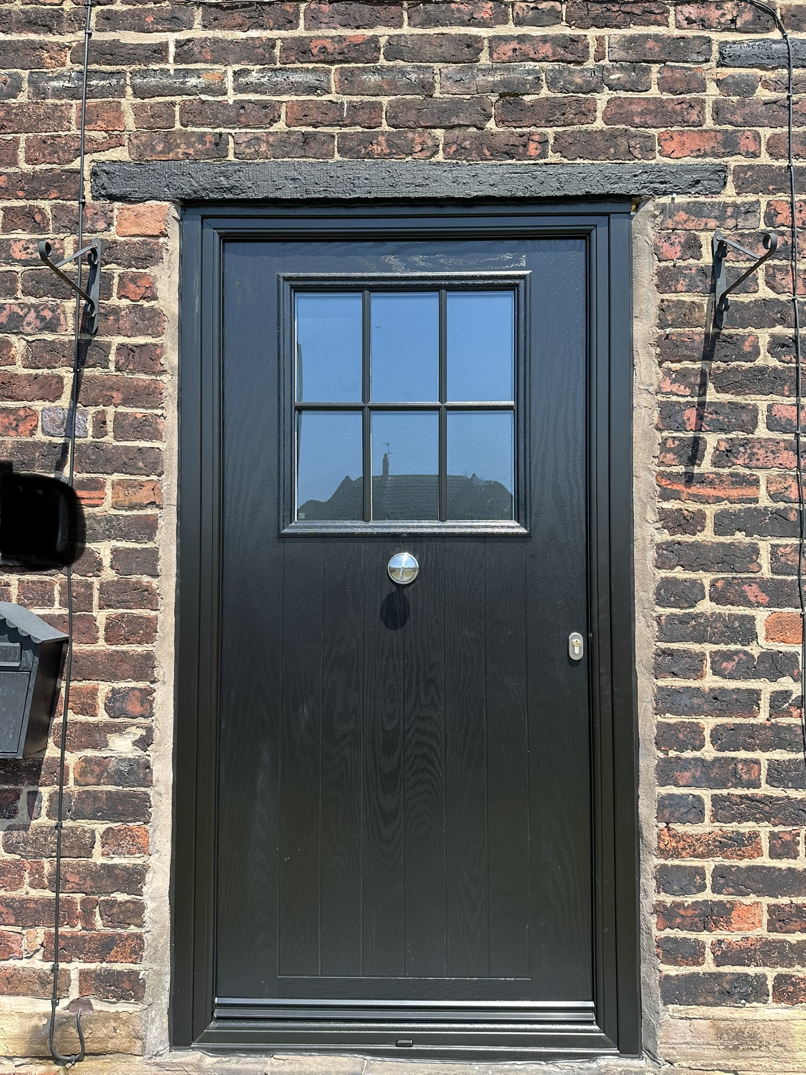 All black farmhouse cottage traditional front composite door with mid-level escutcheon