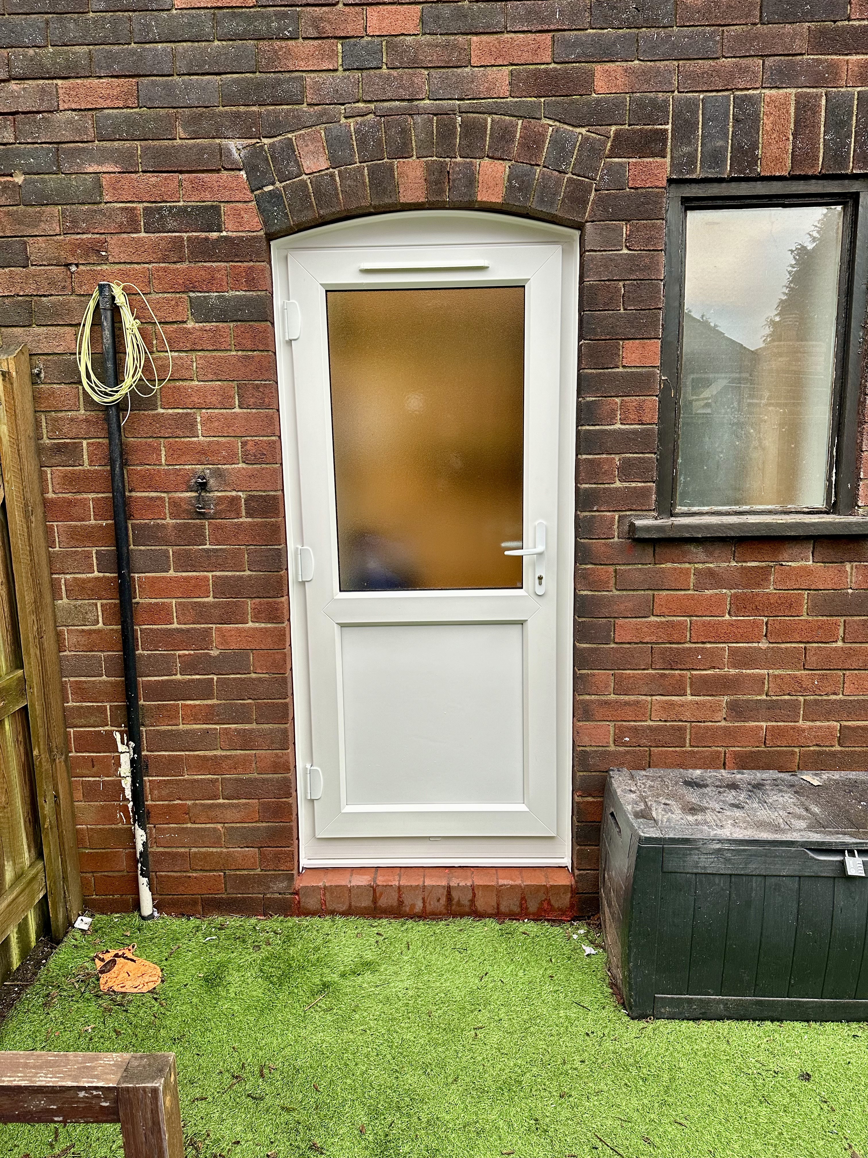 All white PVC Mid-rail back door with stippolyte privacy glass