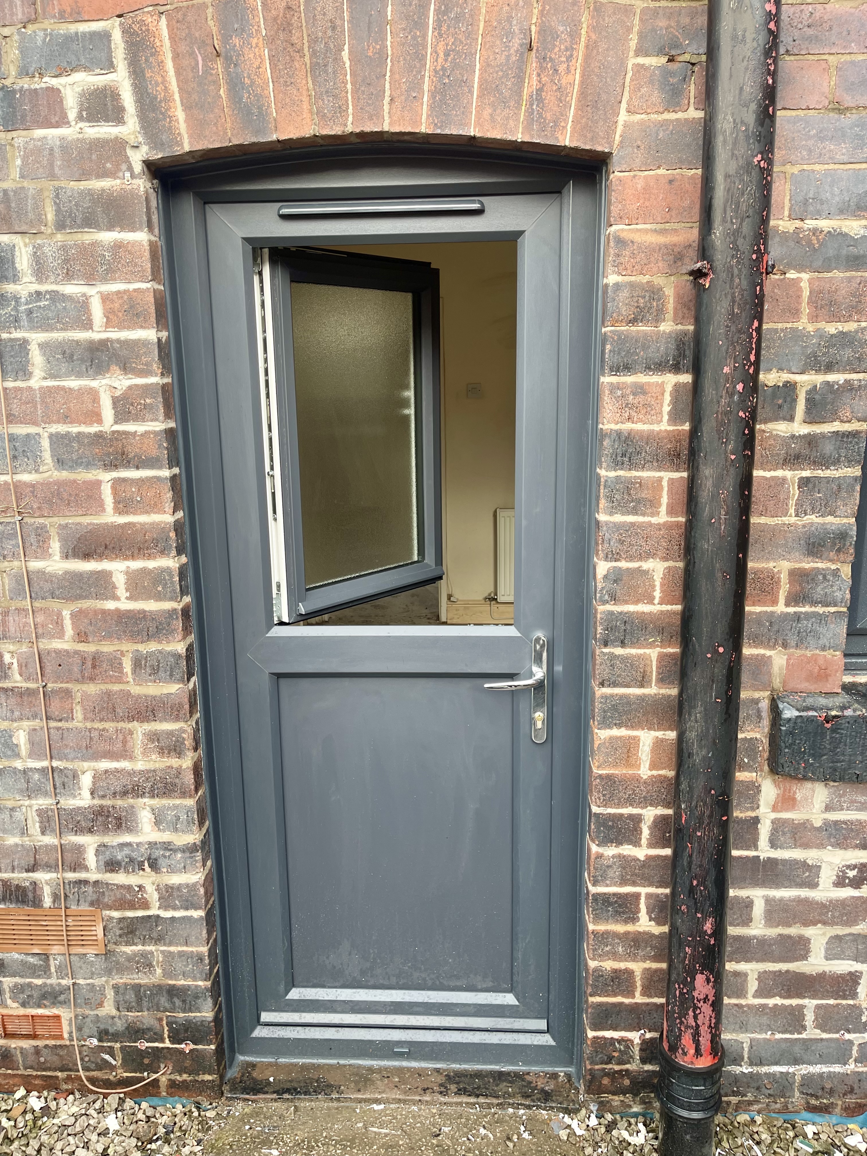 Pvc mid-rail back door in anthracite grey with a tilt