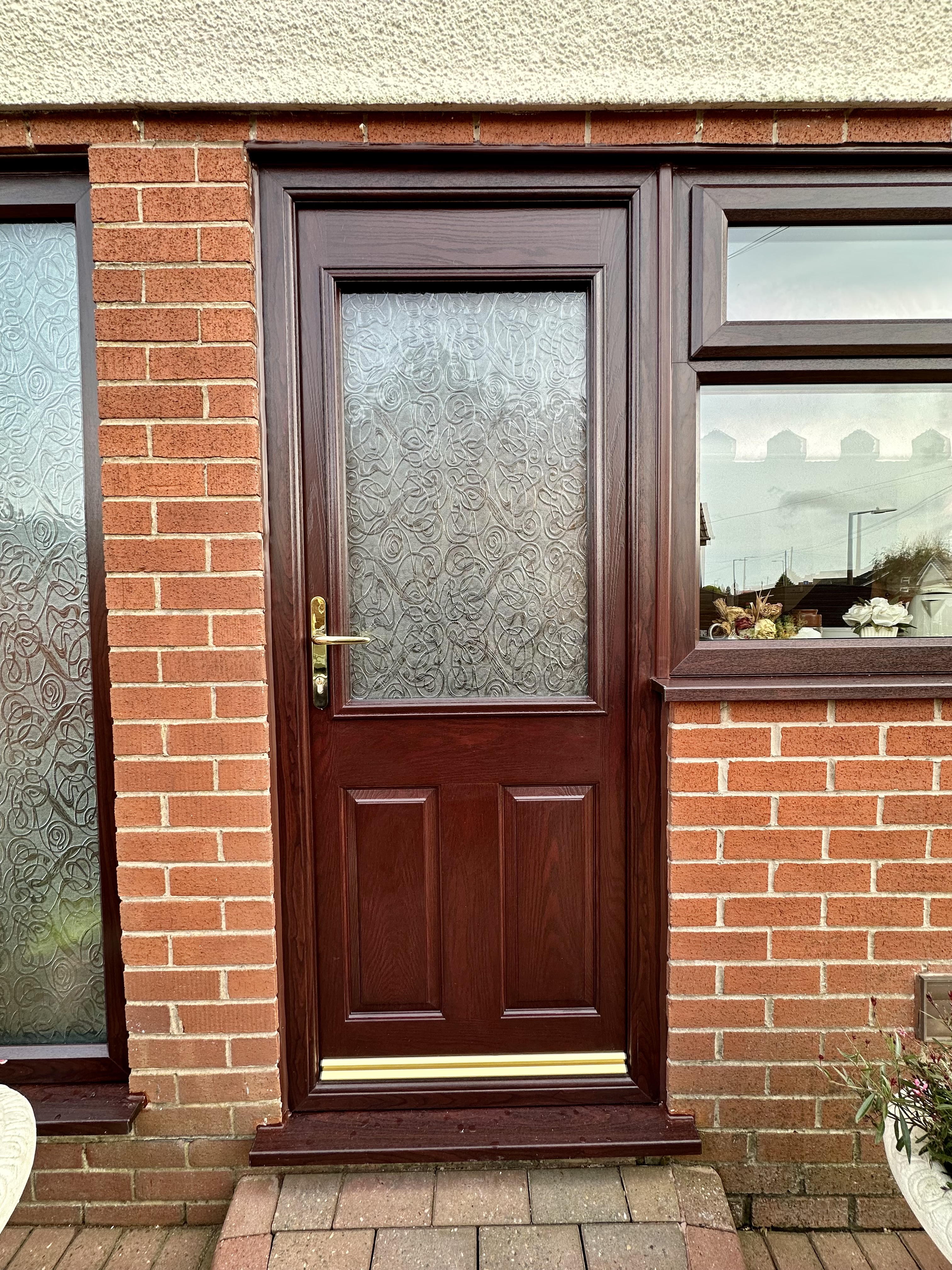 Rosewood brown compoiste back door with everglade privacy glass