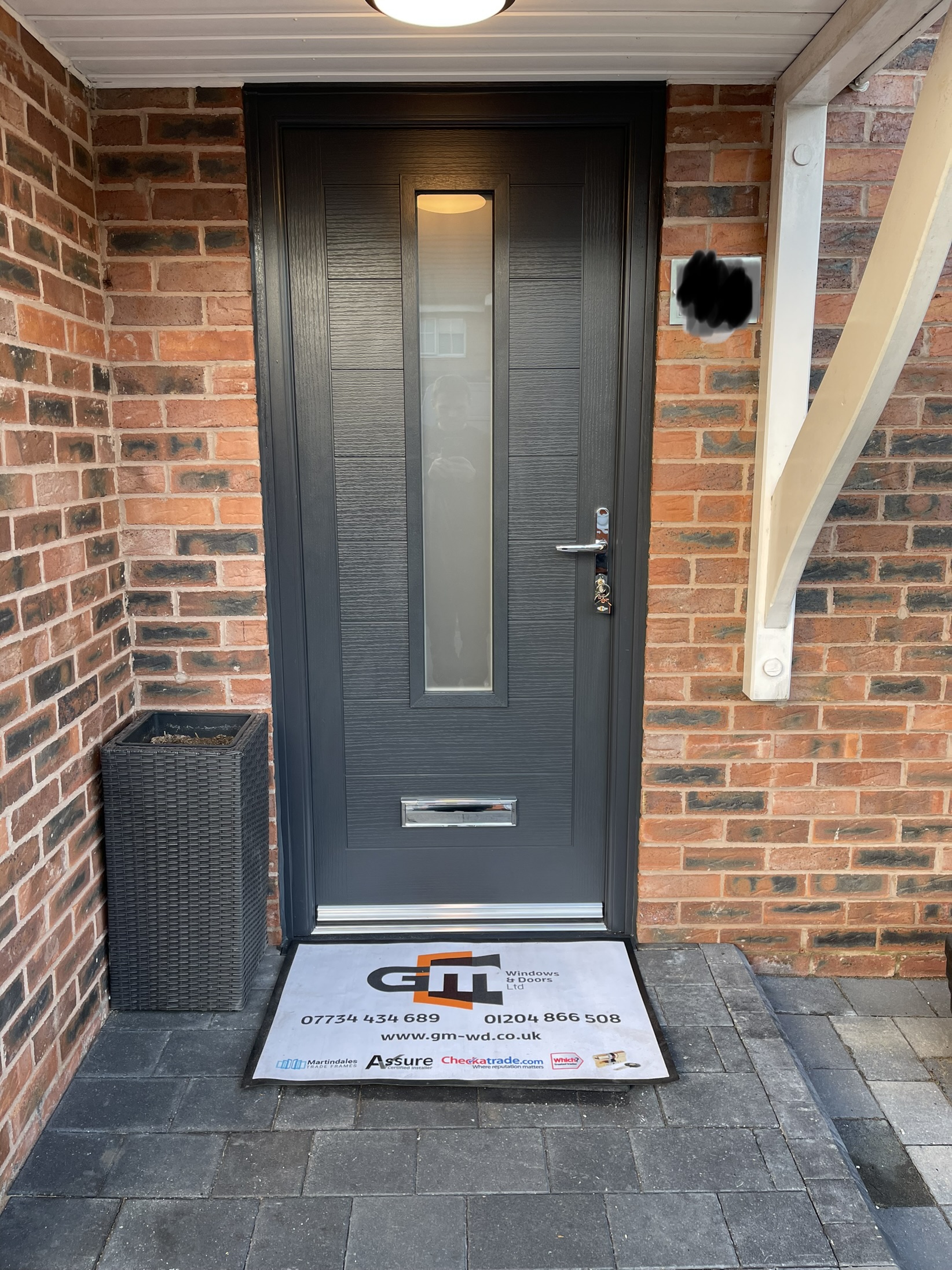 Anthracite grey modern front composite door with normal chrome lever handle