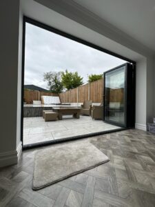 grey 3 pain aluminium bi folding doors wiht integral blinds